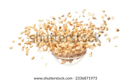 Roasted Peanut bean fall throw up in glass bowl, Roasted Peanut bean float explode, abstract cloud fly. Roasted Peanut beans splash throwing in Air. White background Isolated high speed shutter