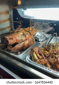 Roasted Pig Head And Roasted Pork Sitting In A Street  Food Vendor Cart On The Streets Of San Juan Puerto Rico.