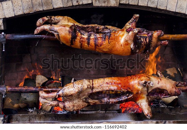 Roasted Pigs Delicious Cooked On Spit Royalty Free Stock Image