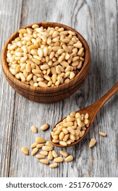 Roasted pine nuts on a wooden table
