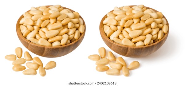 Roasted pine nuts in the wooden bowl,a isolated on the white background.