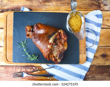 Roasted Pork Leg (rulka) Served With Garlic Sauce On The Wooden Table