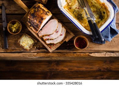 Roasted Pork Loin On The Old Wooden Table