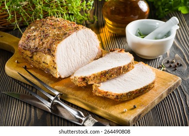 Roasted Pork Loin On The Wooden Table