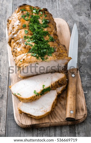 Roasted pork on wooden table