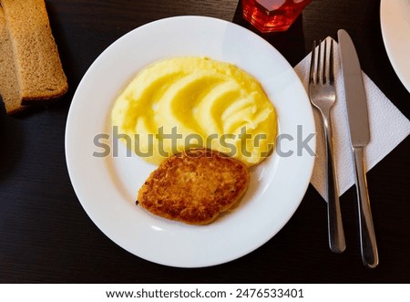 Roasted pork patty served with mashed potato at canteen