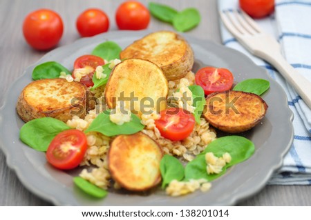 Roasted Potatoes with lentils, spinach and tomatoes