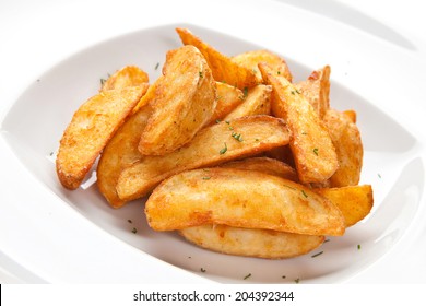 Roasted Potatoes On A White Plate On A White Background Isolated Closeup