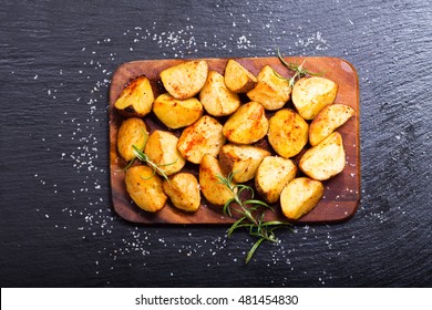 Roasted Potatoes With Rosemary On Dark Background, Top View