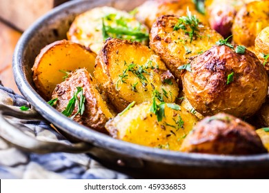 Roasted Potatoes With Smoked Bacon Garlic Salt Pepper Cumin Dill And Herb Decoration.