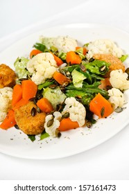 Roasted Pumpkin And Onion Salad With Wilted Spinach And Toasted Almonds. 