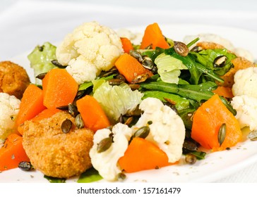 Roasted Pumpkin And Onion Salad With Wilted Spinach And Toasted Almonds. 