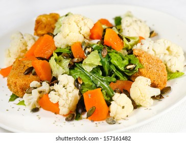 Roasted Pumpkin And Onion Salad With Wilted Spinach And Toasted Almonds. 