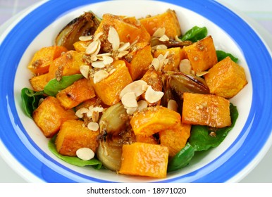 Roasted Pumpkin And Onion Salad With Wilted Spinach And Toasted Almonds.