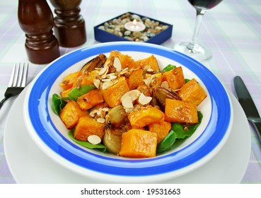 Roasted Pumpkin And Onion Salad With Wilted Spinach And Toasted Almonds.