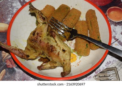 Roasted Quail Served With Breaded Veggie Sticks On The Side