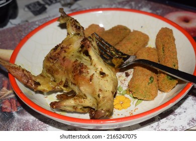 Roasted Quail Served With Breaded Veggie Sticks On The Side