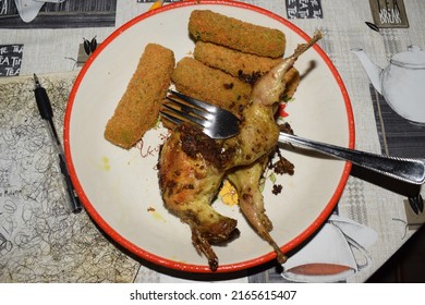 Roasted Quail Served With Breaded Veggie Sticks On The Side