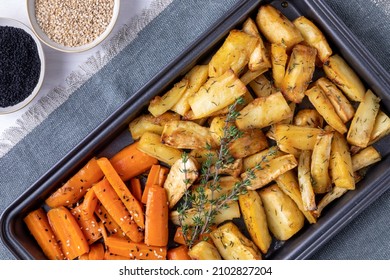 Roasted Root Vegetable Flat Lay. Baked Parsnip And Carrot With Nigella And Sesame Seeds And Thyme Herb.