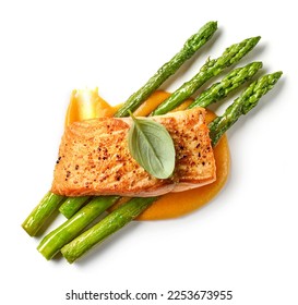 roasted salmon steak and vegetables isolated on white background, top view - Shutterstock ID 2253673955