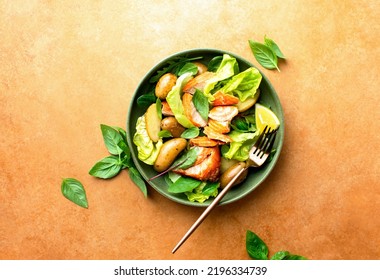 Roasted Salmon And Young Potatoes Salad With Leafy Greens And Lettuce, Top Down View