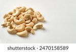 roasted sea salt cashew nuts - Anacardium occidentale - whole and halves. isolated on white background with copy space. natural product of South America