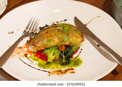 Roasted Seabass Filet On Vegetable On White Plate For Dinner