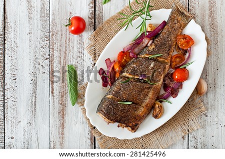 Similar – fresh whole sea bass fish on a black board