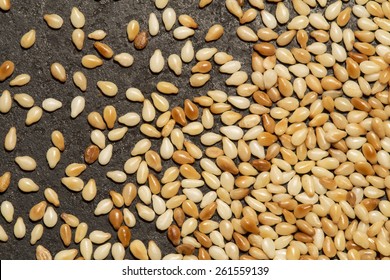 Roasted Sesame Seed On A Black Metal Background