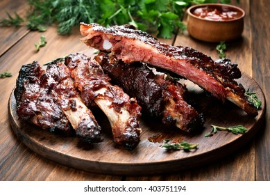 Roasted sliced barbecue pork ribs, focus on sliced meat