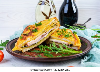 Roasted Toast In Scrambled Eggs With Ham, Herbs And Cheese Cheddar. Delicious Grilled Breakfast Sandwich