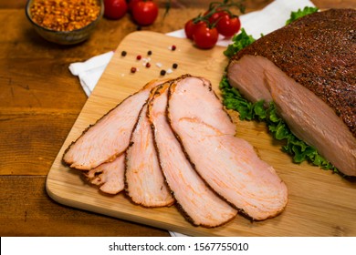 Roasted Turkey Breast Cajun Style Deli Lunch Meat On Old Wooden Background. Selective Focus.