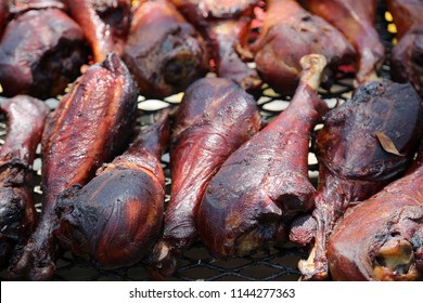 Roasted Turkey Leg On A BBQ Grill. Turkey Leg Grilled At A County Fair. Fair Food. 