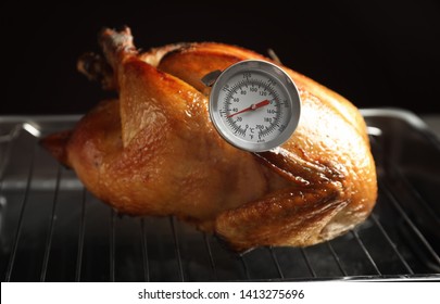 Roasted Turkey With Meat Thermometer On Baking Rack