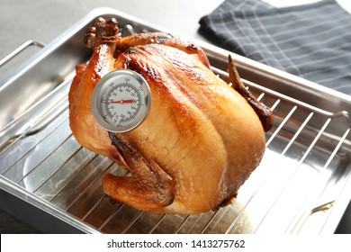 Roasted Turkey With Meat Thermometer On Baking Rack