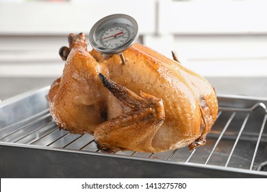 Roasted Turkey With Meat Thermometer On Baking Rack