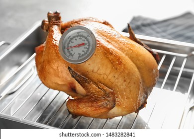 Roasted Turkey With Meat Thermometer On Baking Rack