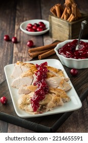 Roasted Turkey Slices Covered With Homemade Cranberry Sauce.