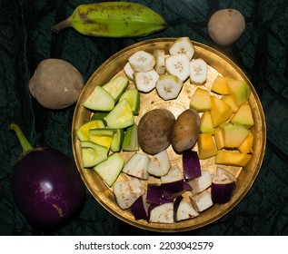 Roasted Vegetable Include Raw Banana, Brinjal, Potato, Pointed Gourd And Pumpkin In A Black Plate. Vegetables For Making Mix Veg Curry.