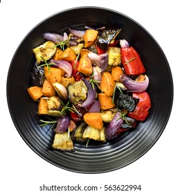 Roasted Vegetables On Black Platter.  Top View, Isolated On White.