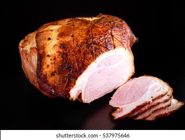 Roasted Whole Sliced Ham On Dark Background