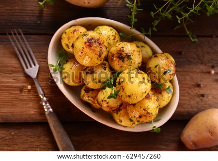 Similar – Image, Stock Photo Seasoned roasted potatoes in a bowl on table