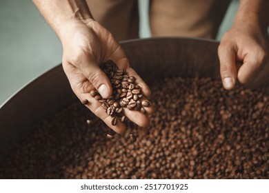 Roaster's Hand Inspecting Roasted Coffee Beans - Powered by Shutterstock