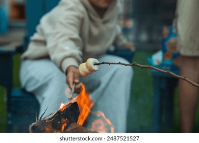 Roasting marshmallows over open flame