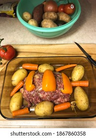 Roasting Pan Uncooked Meatloaf And Potatoes