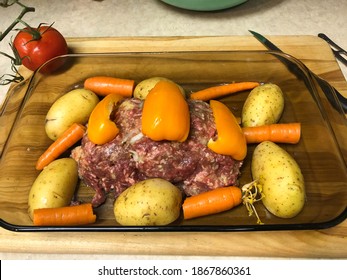 Roasting Pan Uncooked Meatloaf And Potatoes