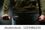 A robber with a big knife - a sharp-assassin murderer about to commit murder, robbery, theft. News articles, newspaper, social advertising