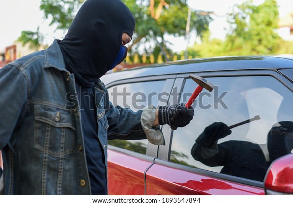 Robber thief criminal bandits in robes
standing next gun robber to seize the
property.