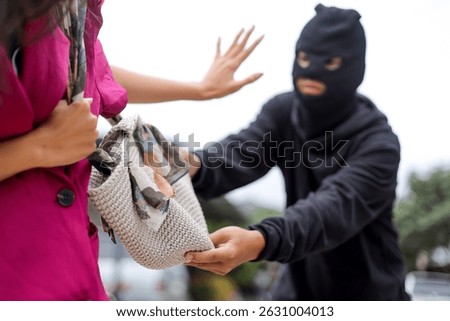Robbery in Action as Man Forcefully Grabs Handbag From Lady.