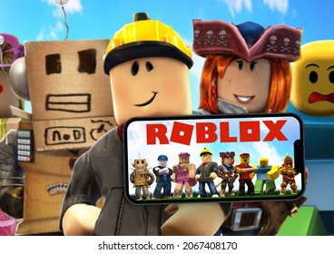Roblox mobile game app on iPhone 13 Pro smartphone screen with the game blurred on background. Rio de Janeiro, RJ, Brazil. October 2021.